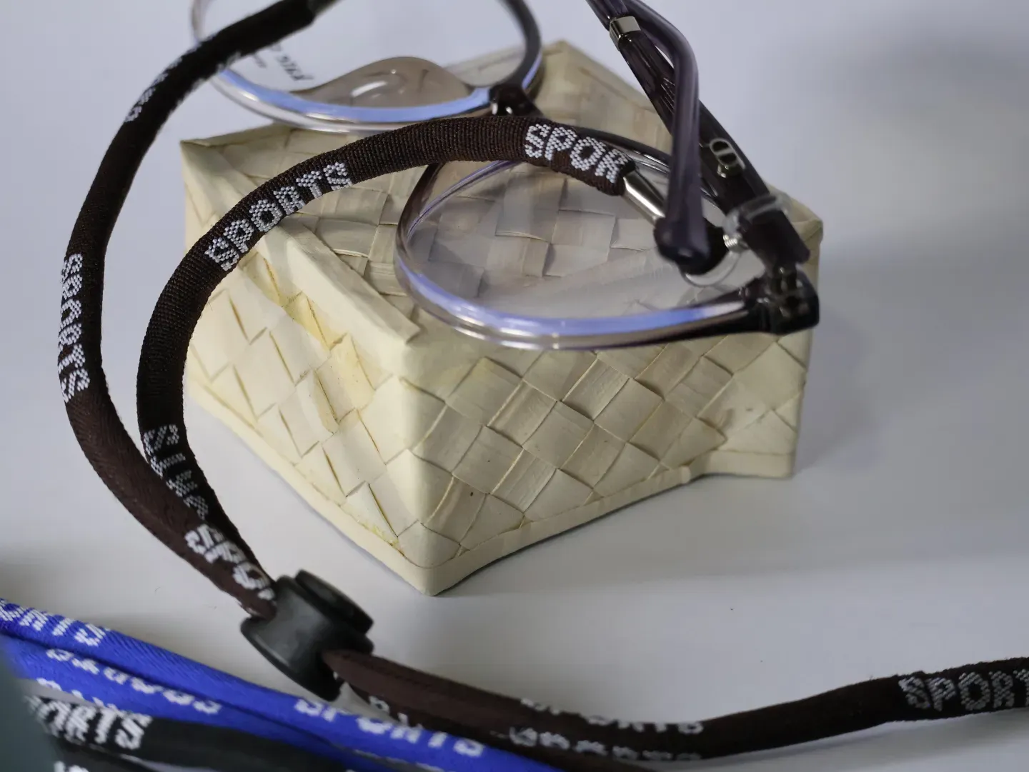 Close up of the adjustable toggle on a sports spectacle strap.