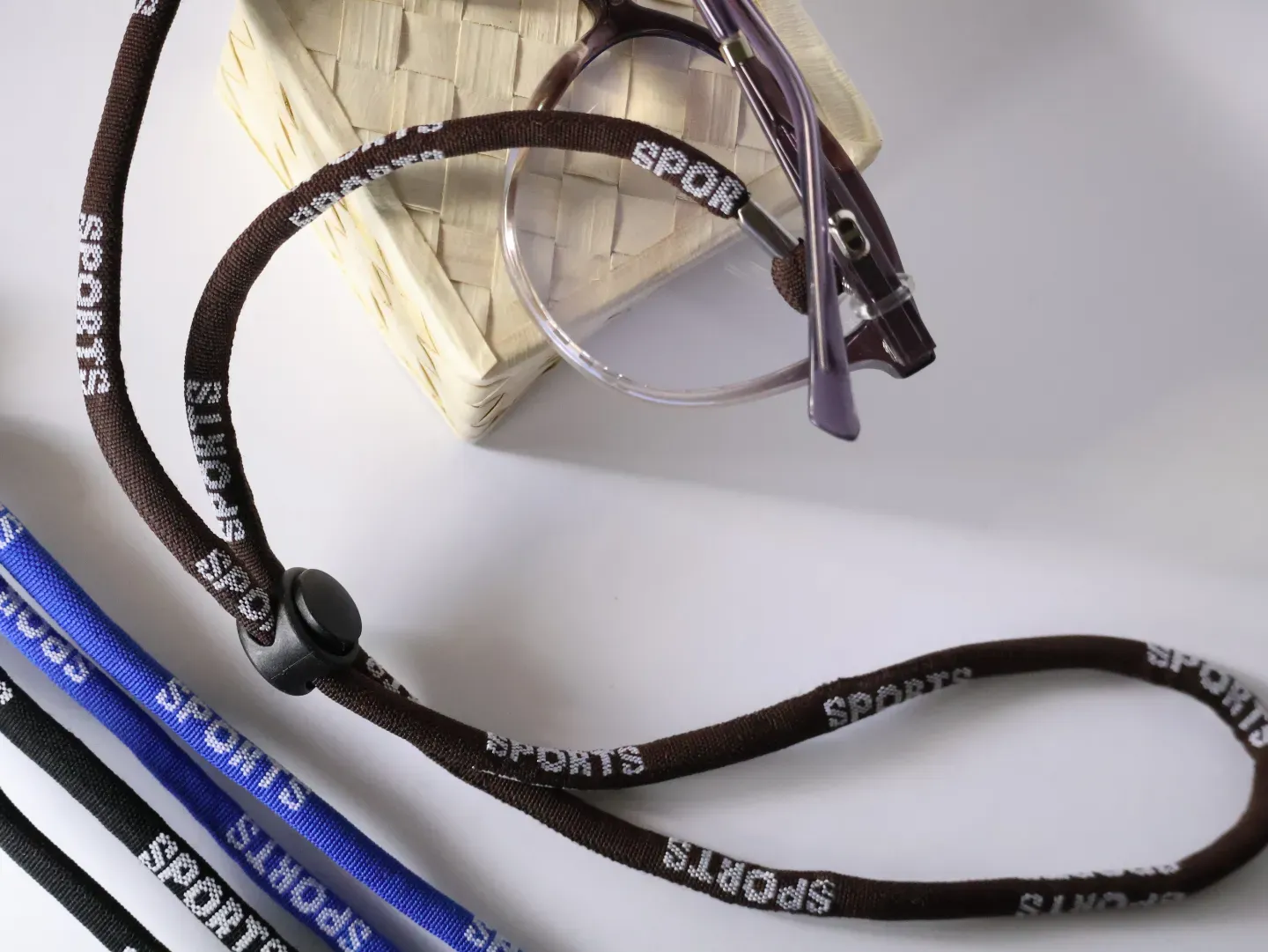 Runner wearing glasses secured with an active sports cord.