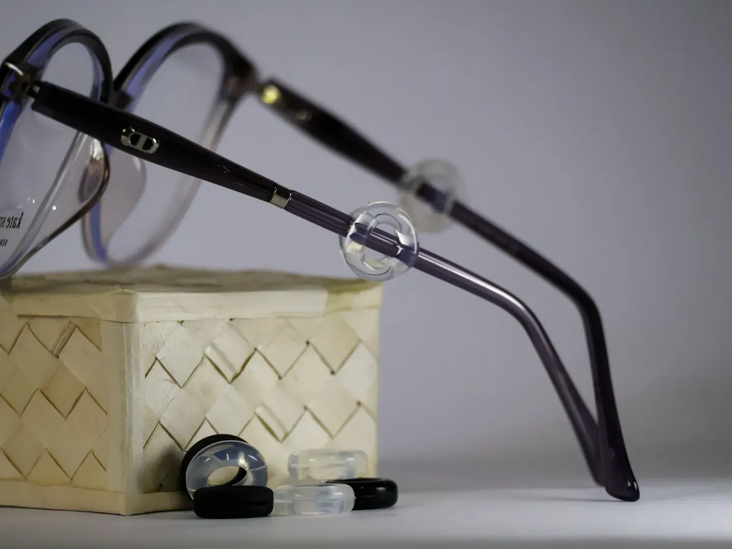 Soft silicone anti-slip ear hooks attached to spectacle temples.