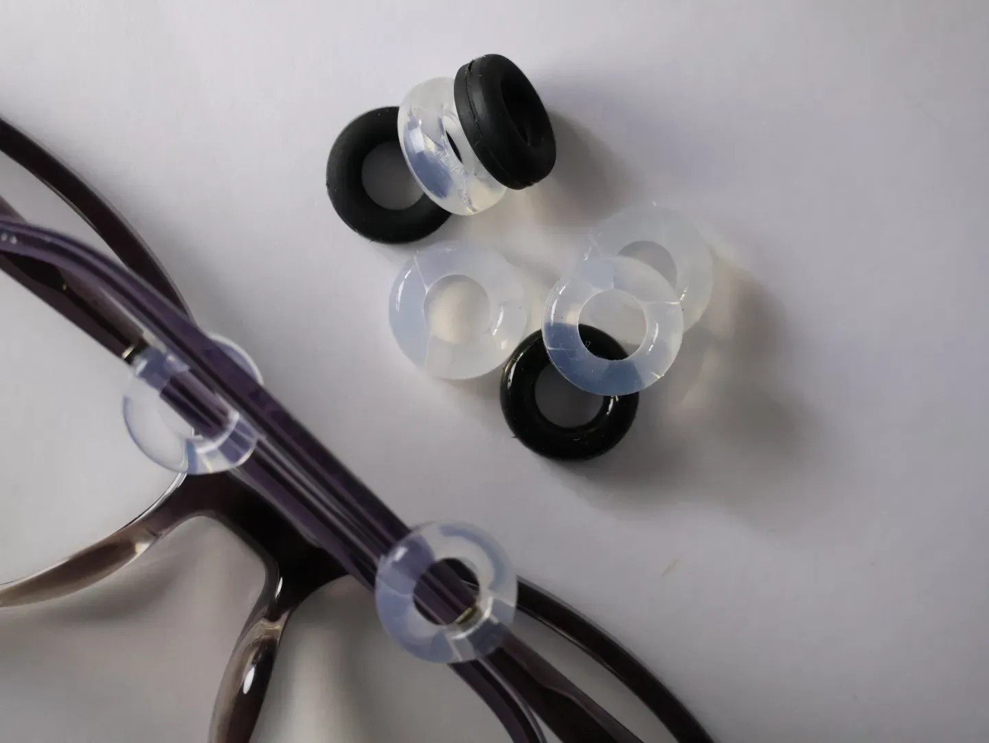Close up of discreet ear hooks preventing glasses from slipping.