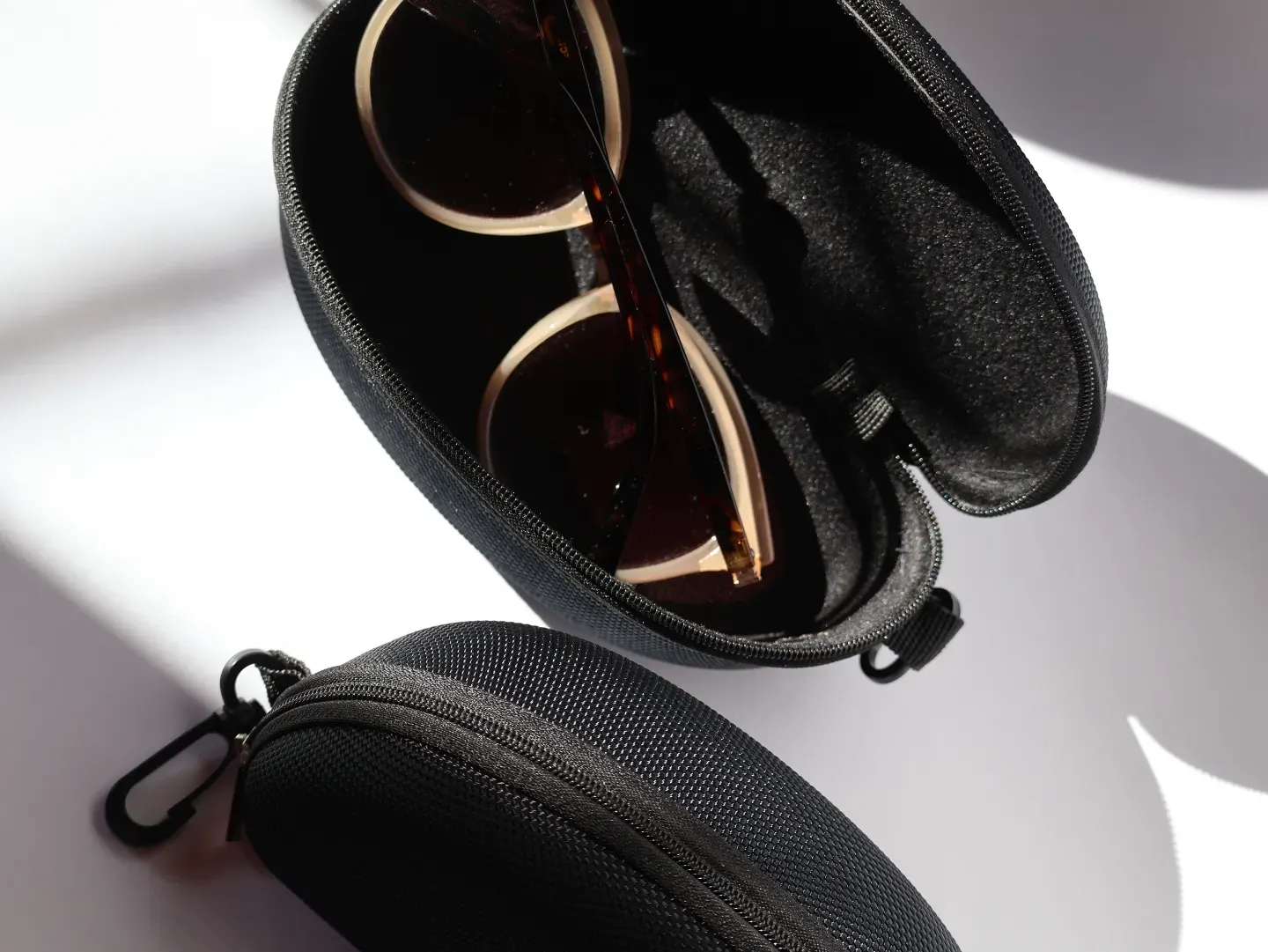 Open protective specs case showing soft velvet interior lining.