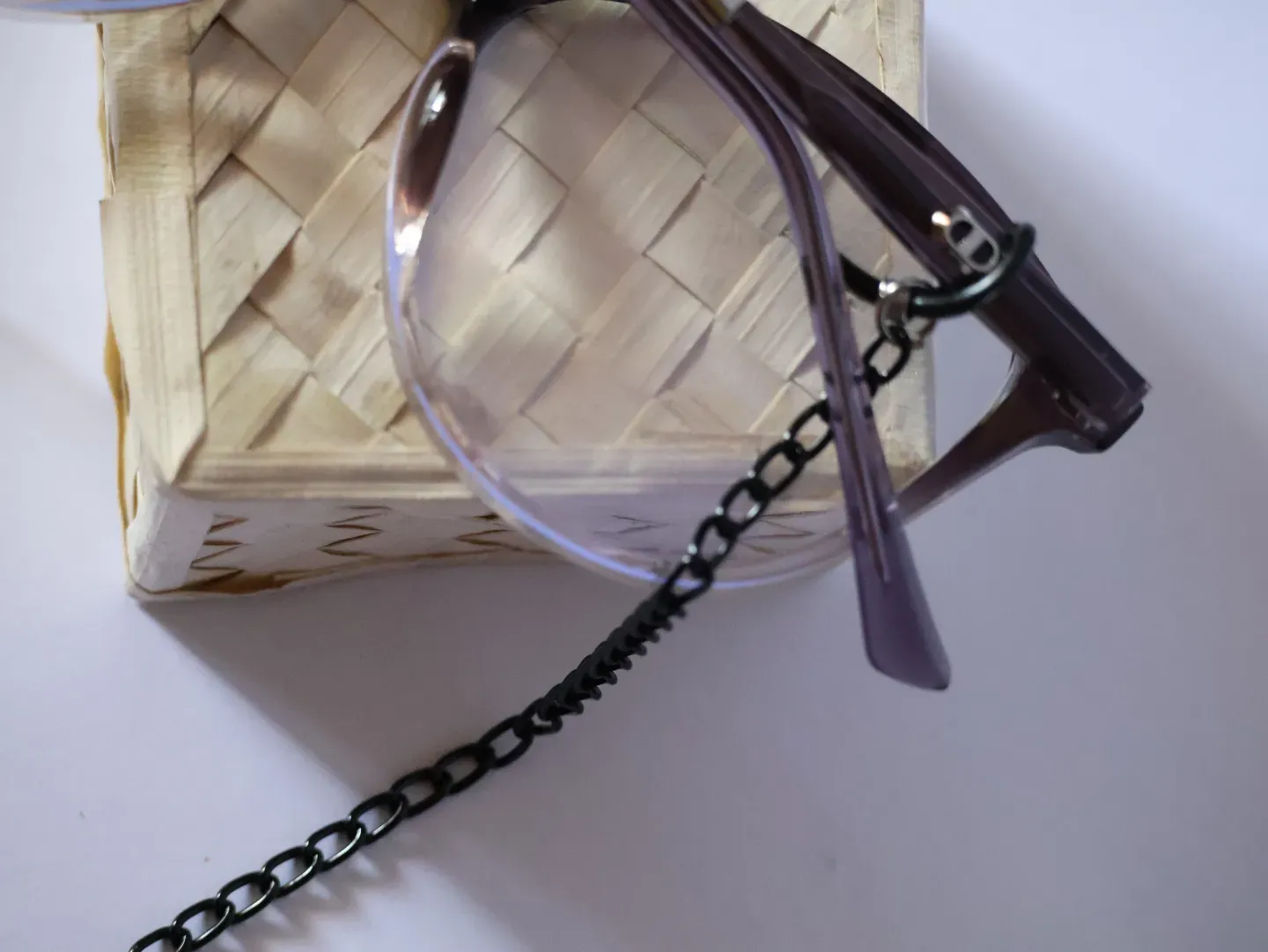 Close up of the secure rubber loop on a metal spectacle chain.