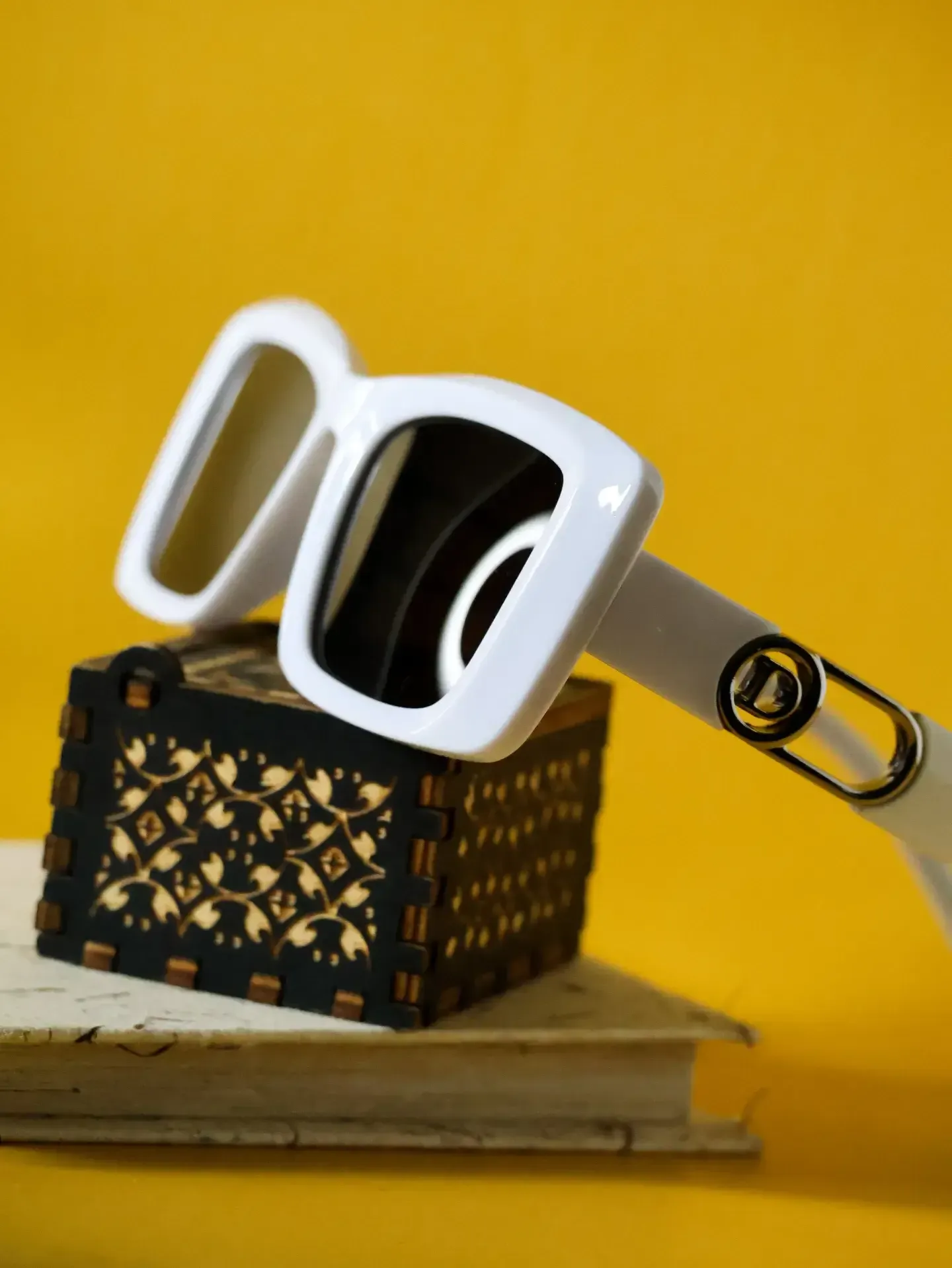 Close-up of Aspen white sunglasses. Visit us in Kottawa for expert eyewear fitting and spectacles repair.