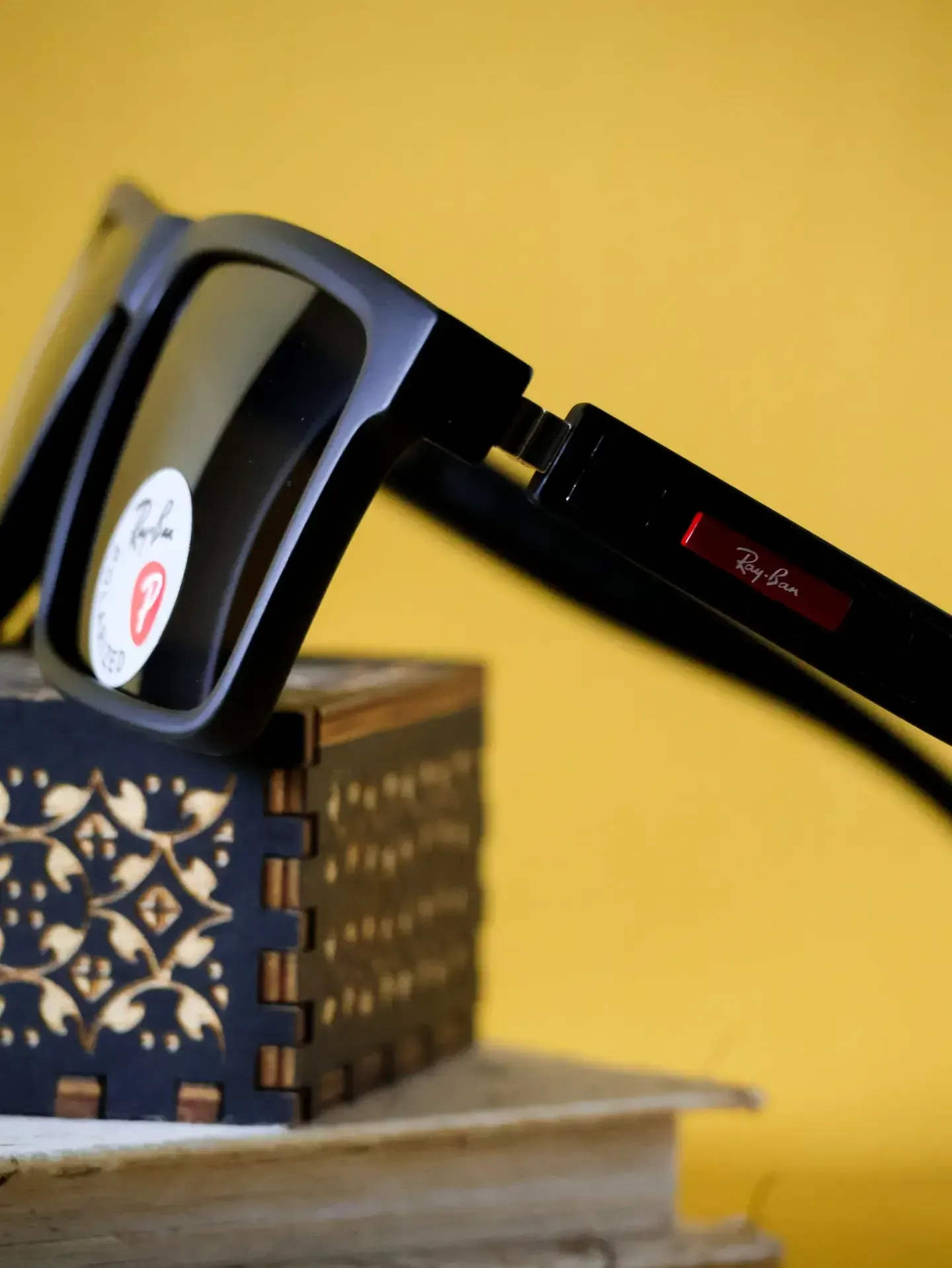 Detailed view of The Maverick dark tinted lenses. Clinical-grade UV block spectacles available at our clinics.