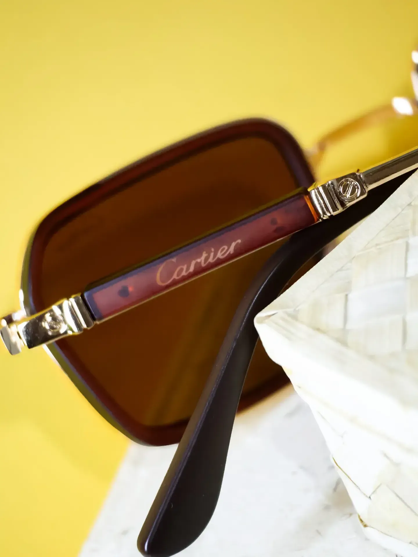 Close-up of gold rim and dark lenses. Available at our optical branches for specs fitting in Bandarawela and Kottawa.