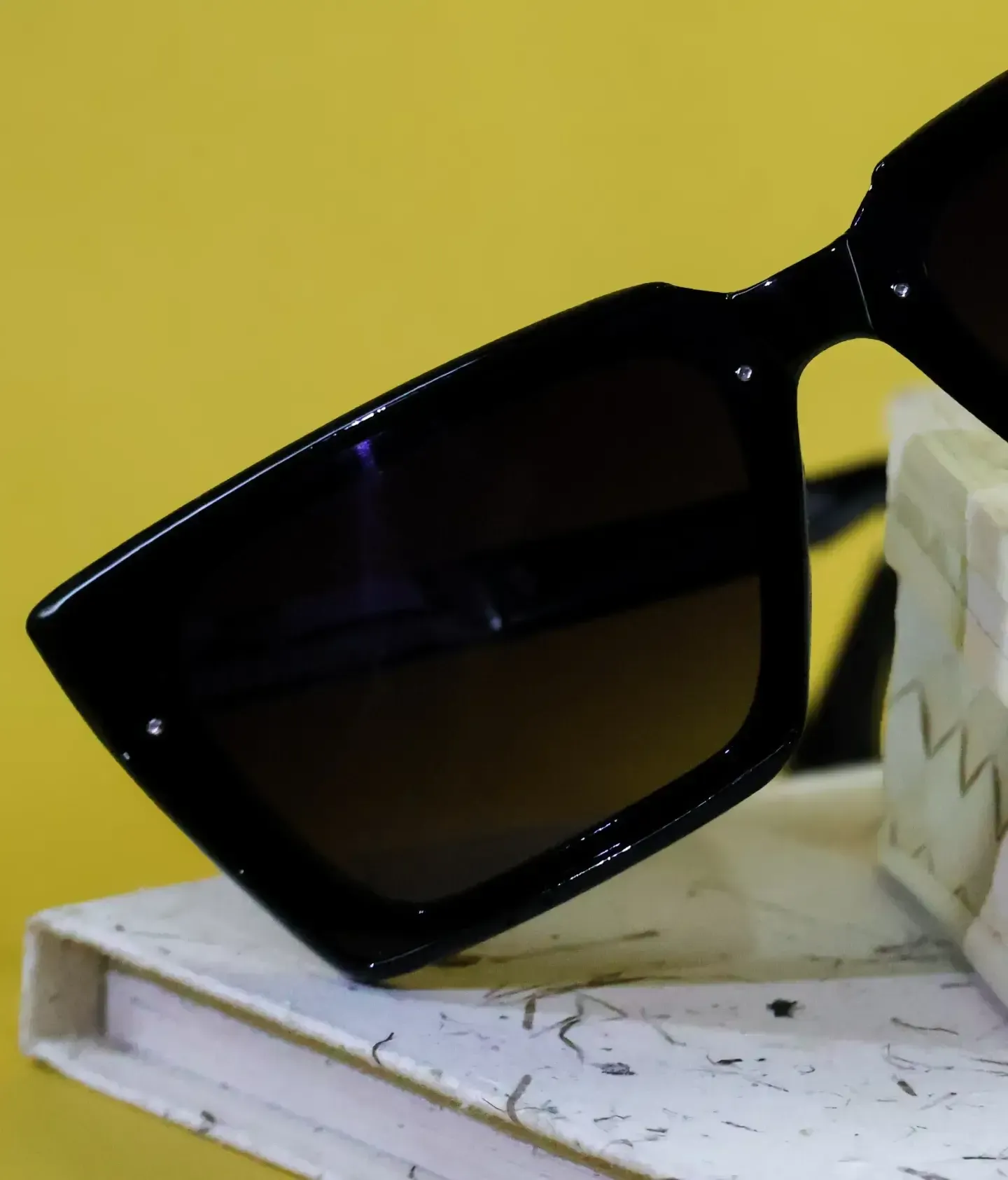Side view showing printed arm detail on Raven sunnies. Stylish and protective dark glasses.